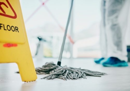 Woman Mopping Floor as Part of Janitorial Services for East Peoria IL